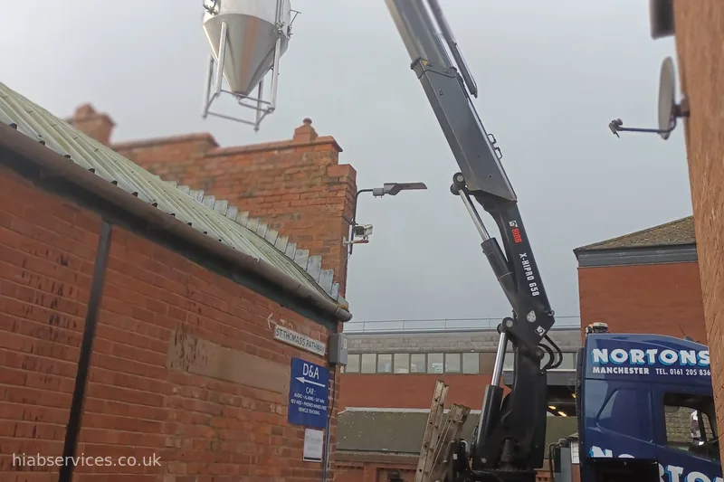 HIAB 658 rigid lifting a brewing tank into position UK
