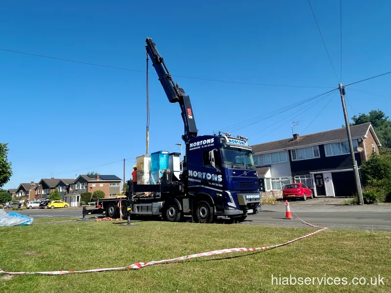 HIAB lorry and driver with a loaded flatbed