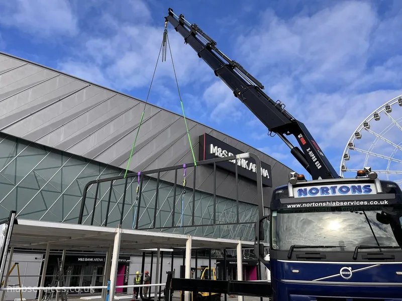 HIAB crane installing signage outside a city-centre venue, Liverpool