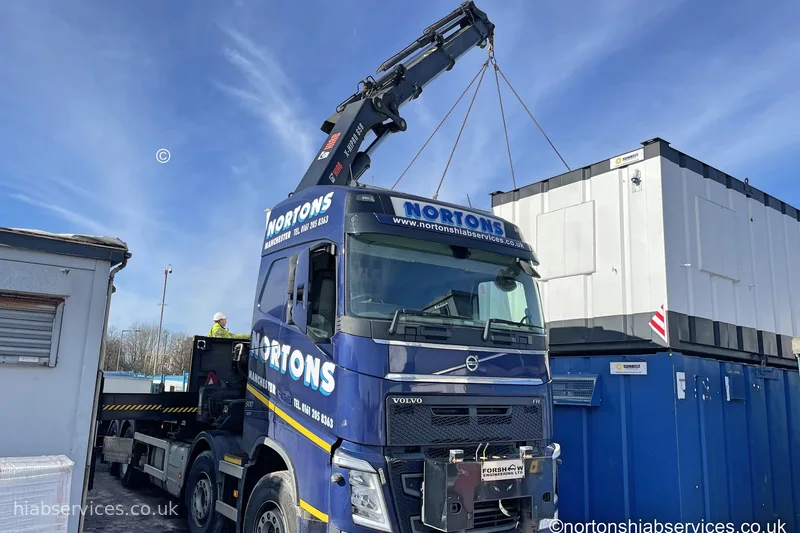Wagon and drag HIAB delivering a portable cabin UK